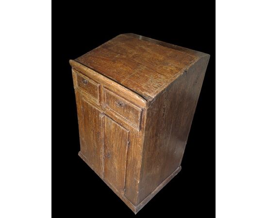 Small writing desk painted to look like wood.