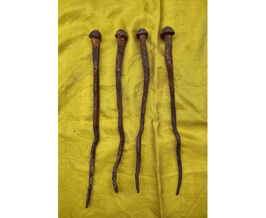 4 Large wrought and embossed iron nails, 17th-18th century