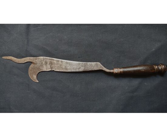 Refined wrought iron and engraved winegrower's tool.