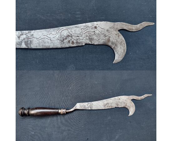 Refined wrought iron and engraved winegrower's tool.