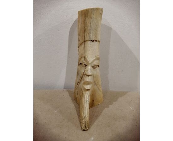 Antique African bone sculpture depicting a face - 19th century