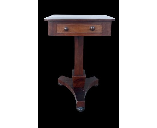 Walnut table with central leg and three-foot base. Empire period.