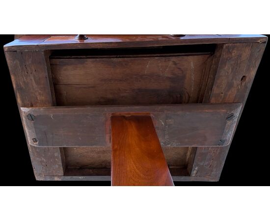 Walnut table with central leg and three-foot base. Empire period.