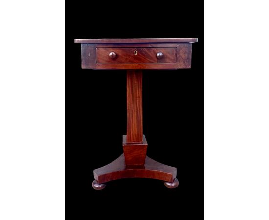 Walnut table with central leg and three-foot base. Empire period.