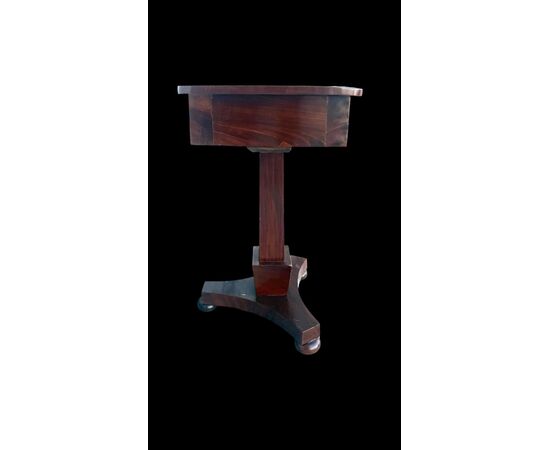 Walnut table with central leg and three-foot base. Empire period.