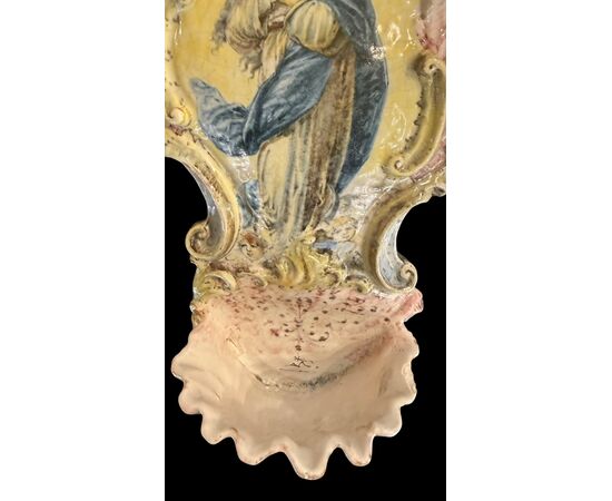 Polychrome majolica holy water font with a depiction of the Madonna. Minghetti. Bologna.