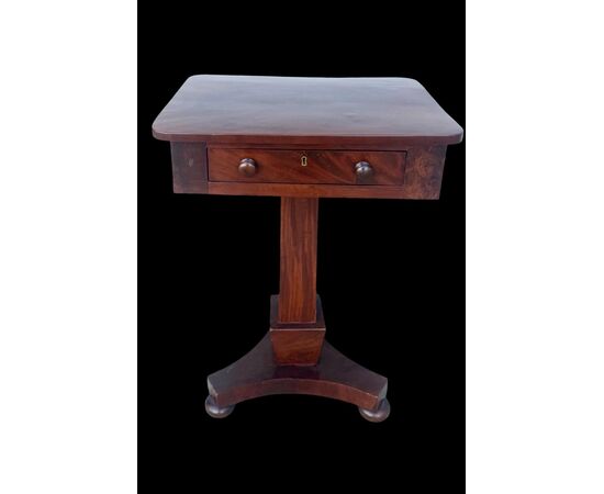 Walnut table with central leg and three-foot base. Empire period.