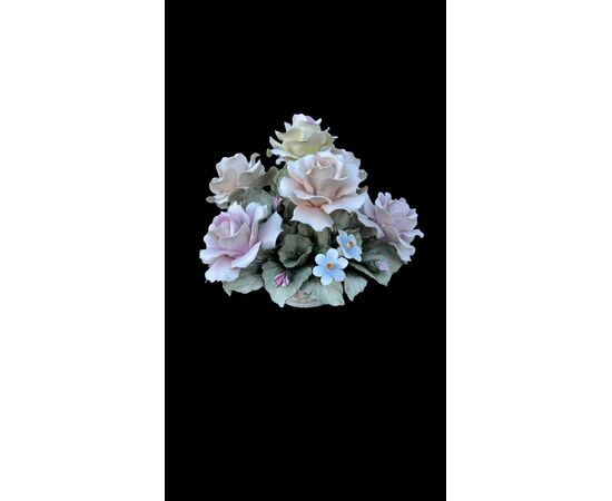 Floral arrangement with Bisquit porcelain basket. Capodimonte.