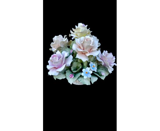 Floral arrangement with Bisquit porcelain basket. Capodimonte.