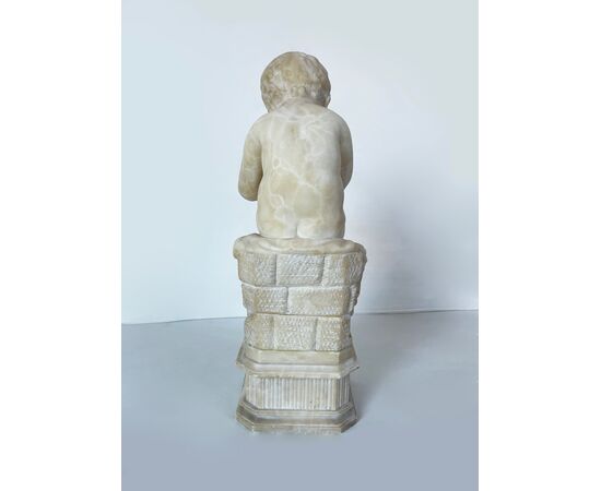 "Putto writing" - alabaster sculpture