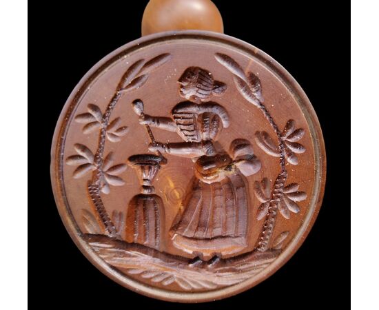 Two round butter stamps with handle, 19th century