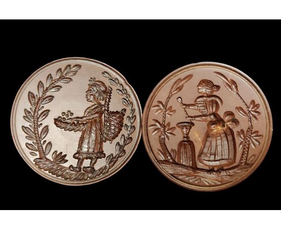 Two round butter stamps with handle, 19th century