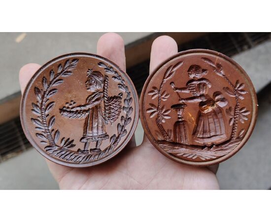 Two round butter stamps with handle, 19th century