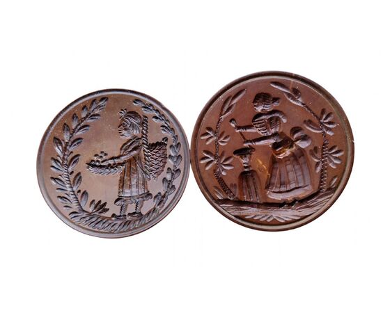 Two round butter stamps with handle, 19th century