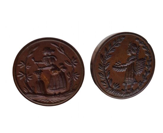 Two round butter stamps with handle, 19th century