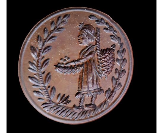 Two round butter stamps with handle, 19th century