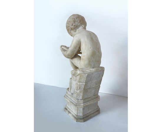 "Putto writing" - alabaster sculpture