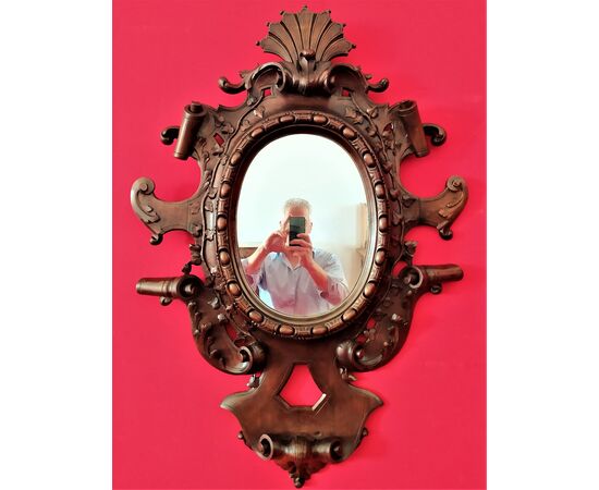 Mirror in carved wood