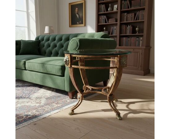 
Tavolino in ferro bronzato con teste di leone