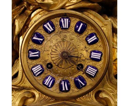 French clock in golden antimony