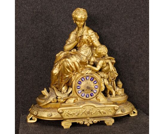 French clock in golden antimony