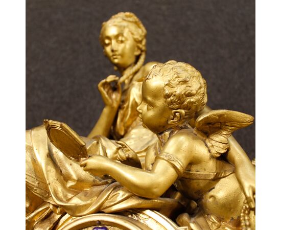 French clock in golden antimony