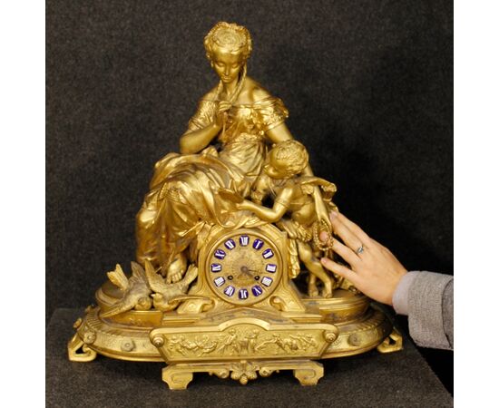 French clock in golden antimony