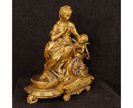 French clock in golden antimony