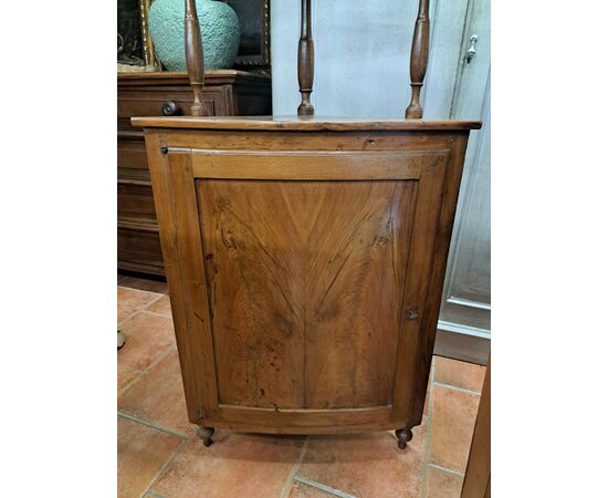 Pair of serpentine corner cabinets in blond walnut