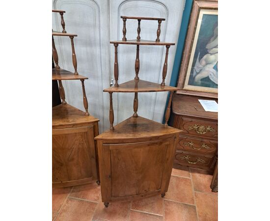 Pair of serpentine corner cabinets in blond walnut