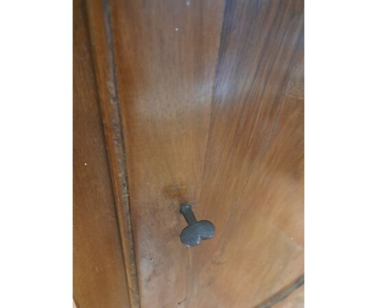 Pair of serpentine corner cabinets in blond walnut