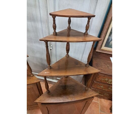 Pair of serpentine corner cabinets in blond walnut