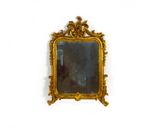 Small carved, sculpted, and gilded wooden mirror, 19th century