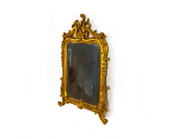Small carved, sculpted, and gilded wooden mirror, 19th century