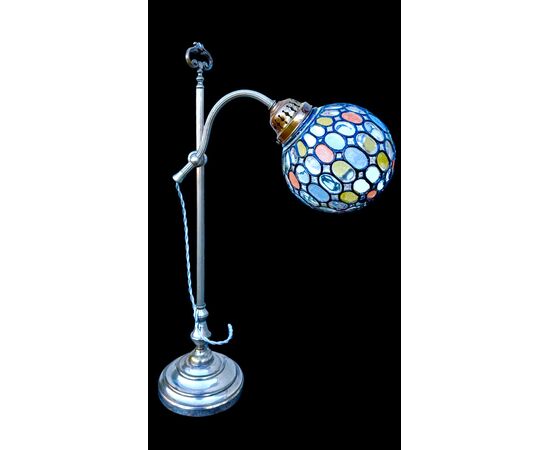 Lamp with metal stem and globular part with leaded glass.