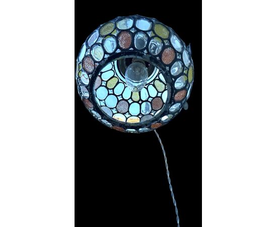 Lamp with metal stem and globular part with leaded glass.