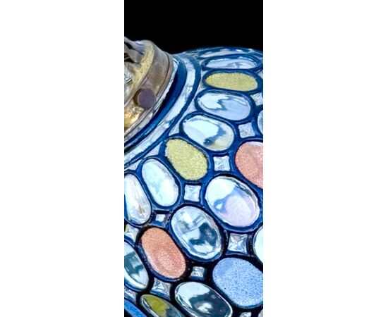 Lamp with metal stem and globular part with leaded glass.