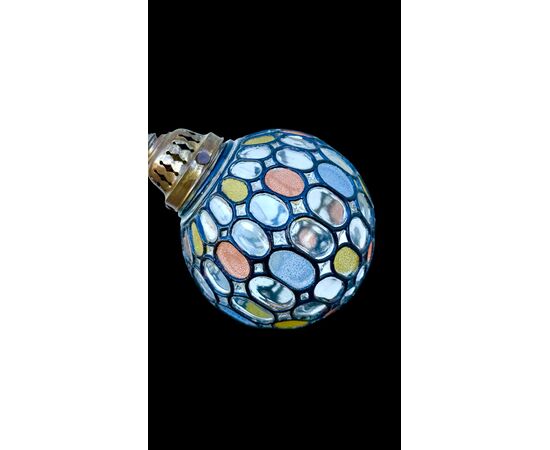 Lamp with metal stem and globular part with leaded glass.