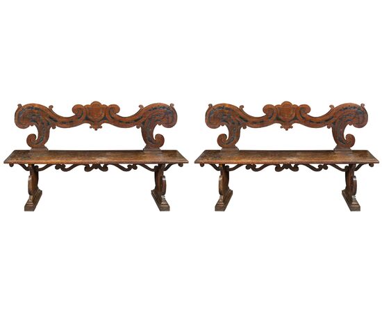 Pair of noble benches in carved solid walnut. Northern Italy, 17th century.