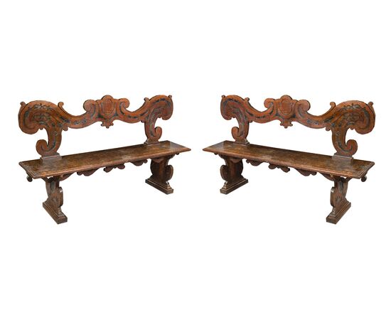 Pair of noble benches in carved solid walnut. Northern Italy, 17th century.