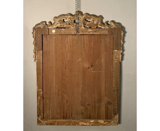Carved and lacquered wooden mirror. Venice, 18th century.
