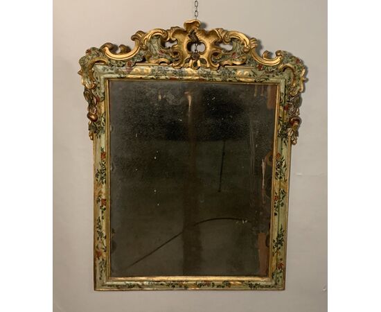 Carved and lacquered wooden mirror. Venice, 18th century.