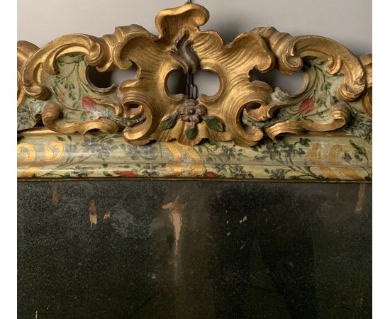 Carved and lacquered wooden mirror. Venice, 18th century.