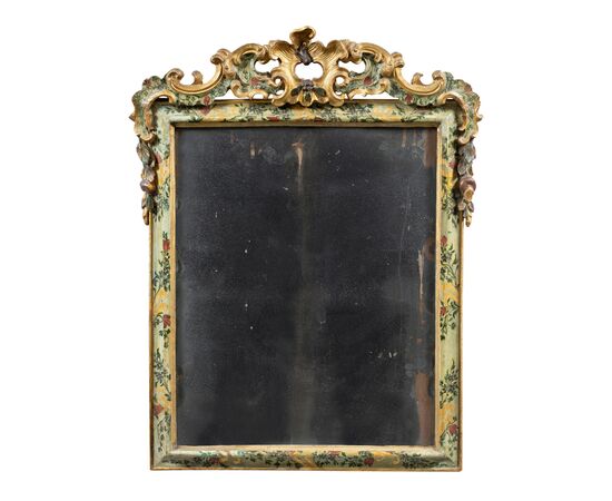 Carved and lacquered wooden mirror. Venice, 18th century.