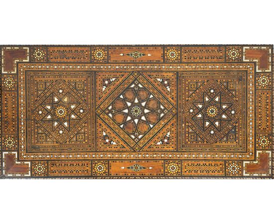 Antique game table in polychrome woods with mother-of-pearl inlays. Syria 19th century.