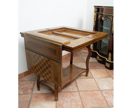 Antique game table in polychrome woods with mother-of-pearl inlays. Syria 19th century.