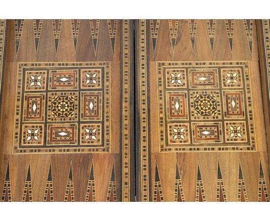 Antique game table in polychrome woods with mother-of-pearl inlays. Syria 19th century.