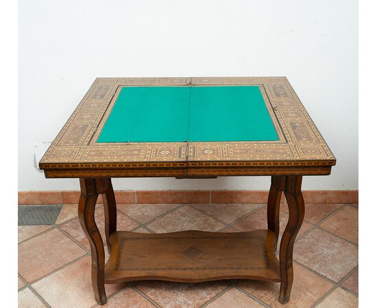 Antique game table in polychrome woods with mother-of-pearl inlays. Syria 19th century.