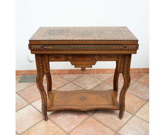 Antique game table in polychrome woods with mother-of-pearl inlays. Syria 19th century.