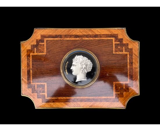 Inlaid wood box with geometric motifs.